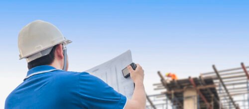 Engineer is inspecting his work in building construction site